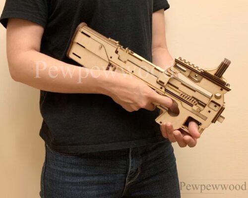 Pistola de juguetes lanza gomas