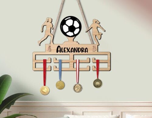 Colgador de medallas de fútbol femenino